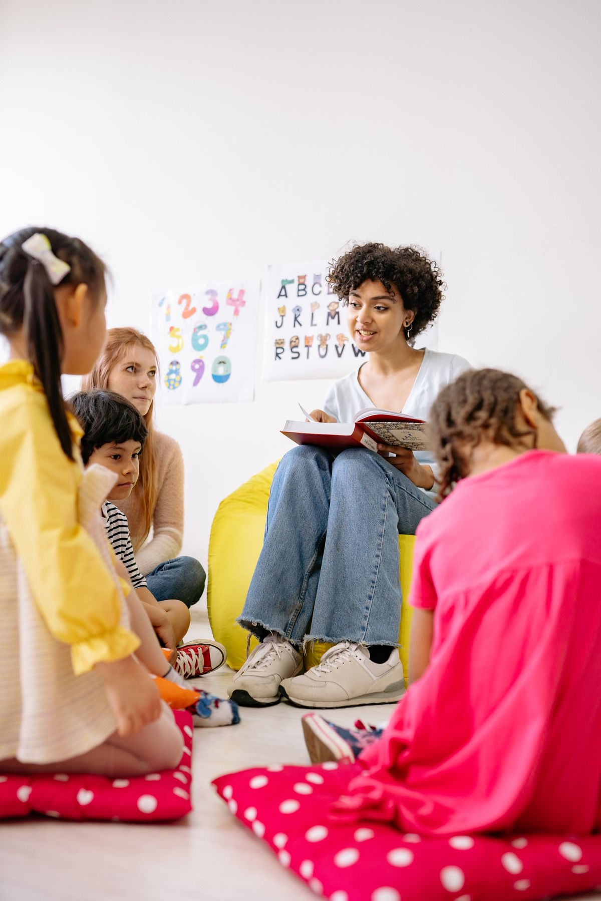 Teacher guiding an elementary student